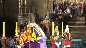 Silent crowds file past the coffin of the only British monarch most have known