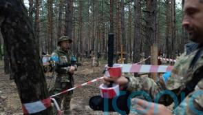Some bodies in mass burial site in Ukraine show torture signs, says prosecutor