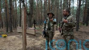 Mass burial site includes torture victims, says Ukraine’s president