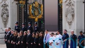Buckingham Palace staff line up outside gates to pay respects to Queen