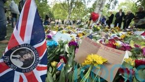 Thousands spill into Hyde Park to watch Queen’s coffin pass by