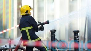 Dozens of firefighters stop supermarket fire spreading to school