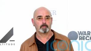 Former Oasis guitarist Bonehead says his tonsil cancer has ‘gone’