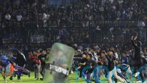 174 dead after stampede at Indonesian football match