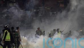 At least 125 killed as tear gas triggers crush at Indonesian football match