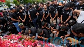 Police probe tear gas use at Indonesian football match after 125 die in crush
