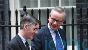 Michael Gove and Jacob Rees-Mogg trade polite blows across conference floor