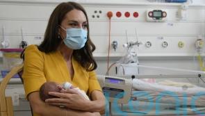 ‘She’s very sweet’: Kate cradles premature baby on visit to maternity unit