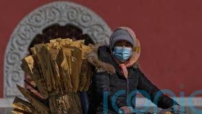 China imposes lockdowns as Covid-19 surges after holiday