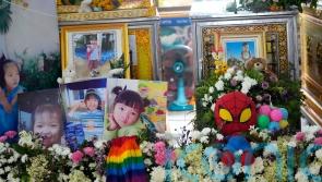 Relatives of Thai daycare massacre victims prepare for group cremation