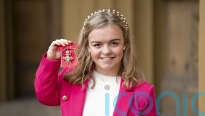 Paralympic swimmer Maisie Summers-Newton hails her hero as she collects MBE