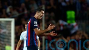 Robert Lewandowski scores late equaliser to give Barcelona Champions League hope