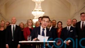 New Swedish PM presents three-party centre-right government