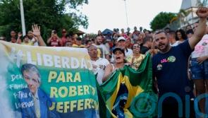 Bolsanaro ally throws grenades at police days ahead of presidential election