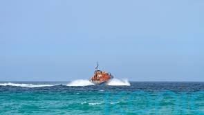 Crew rescued from life raft after fishing boat runs aground