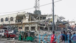 Two explosions hit Somali capital, leaving scores dead or injured