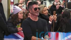 Simon Cowell says he was ‘really unhappy’ and a workaholic before becoming a dad