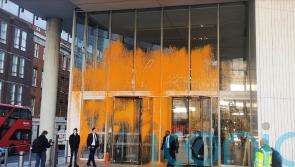 Arrests made after Just Stop Oil activists spray orange paint on buildings