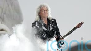 Brian May ‘proud’ Queen tapped We Will Rock You intro in Paddington Bear skit