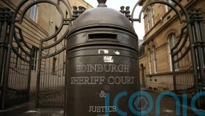 Second person charged after two men found dead in Edinburgh flat