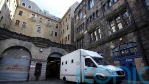 Second man in court charged with murder over deaths of men in flat