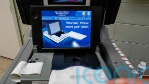 Election scrutiny high but no big hitches reported amid voting in US midterms