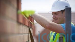 Taylor Wimpey says sales dampened by economic storm