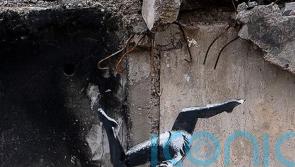 Banksy reveals artwork on side of damaged building in Ukraine