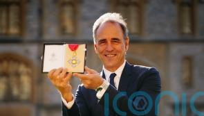 Anthony Horowitz calls for investment in school libraries as he receives CBE