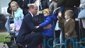 Prince of Wales hugs little boy and promises to put picture on his fridge
