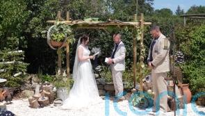 Couple throw festive July wedding in France complete with Christmas trees, crackers and songs