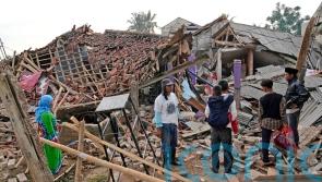 Indonesia earthquake death toll rises to 252 as more bodies found