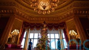 In Pictures: Royal staff deck Windsor Castle hall with 20ft Christmas tree