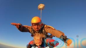 Grandma who lost her legs because of rare blood clot skydived 15,000 feet out of a plane to fund her independence