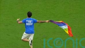 Qatar pitch invader who carried rainbow flag says he will not face legal action
