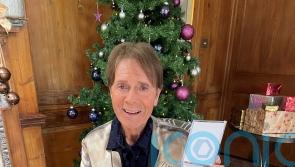 Sir Cliff Richard checks out chart competition as he poses with Stormzy album