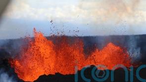 Hawaiian volcano’s lava oozes toward key Big Island road