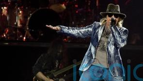 Axl Rose vows to stop throwing mic into the crowd following reported injury