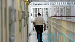 Inspector warns of reoffending risk as prisoners locked in cells 23 hours a day