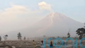Search under way after volcanic eruption buries Indonesian island homes