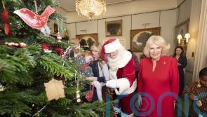 Camilla declares Christmas has begun as she hosts children’s charities