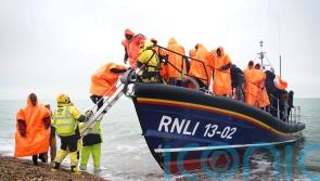 Shivering migrants brought ashore in Kent