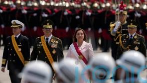 New Peru president appears with military to cement power