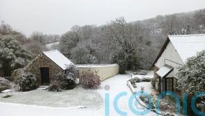 Snow sweeps in as cold snap continues