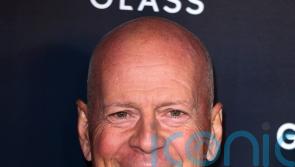 Bruce Willis cuddles puppy in first family photos since retirement due to health