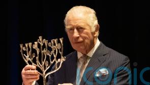 King dances with Anne Frank’s stepsister during visit to Jewish community centre