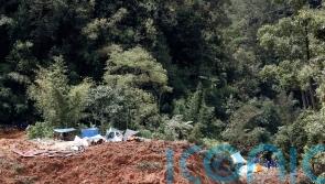 At least 21 die after landslide engulfs campsite in Malaysia
