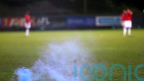 Melbourne derby abandoned as goalkeeper hit by metal bucket in ‘shocking scenes’