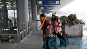 Holiday travel upended in the US as forecasters warn of ‘bomb cyclone’