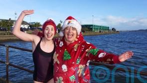 Hundreds of plucky swimmers brave chilly sea for charity